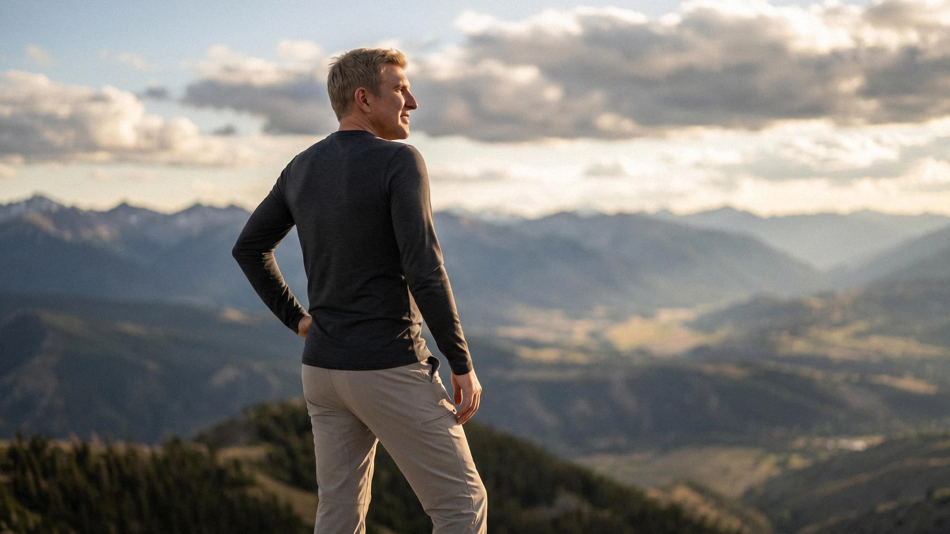 Todd Chrisley overlooking a mountain valley at golden hour